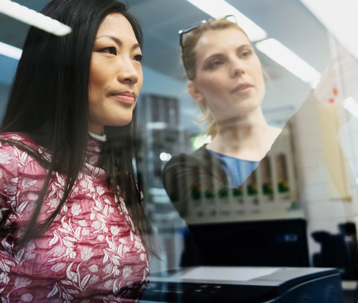 Two Recruitics employees discussing the iON platform