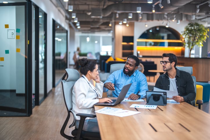 Tech employees discussion a project